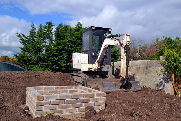 istock mini excavator on a residential building site 516485177