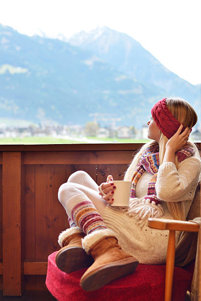 istock Beautiful woman on the balcony drinking coffee 516487413