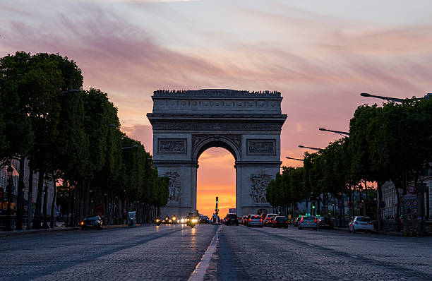 istock Arch of Triumph (Arc de Triomphe) with dramatic sunset behind 516487767