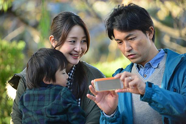 istock Young Japanese Couple with a son 516487861