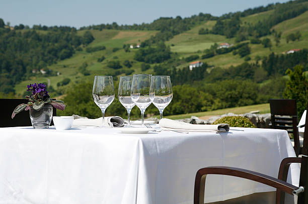 istock Restaurant table with glasses and dishes prepared 516491093