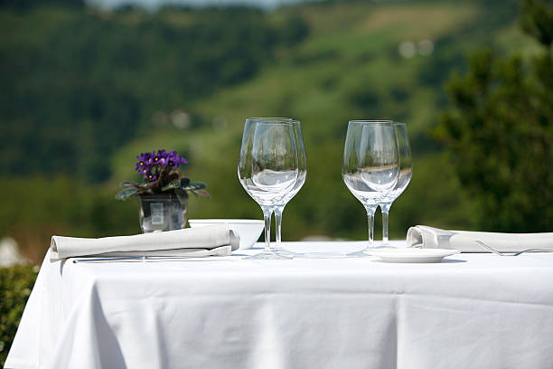 istock Restaurant table with glasses and dishes prepared 516491099