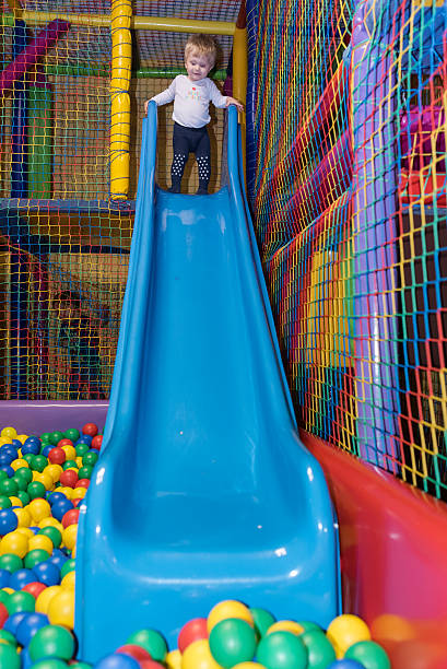 istock Toddler preparing to slide 516492662