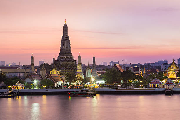 istock Beautiful sky after sunset over Arun temple waterfront 516492680