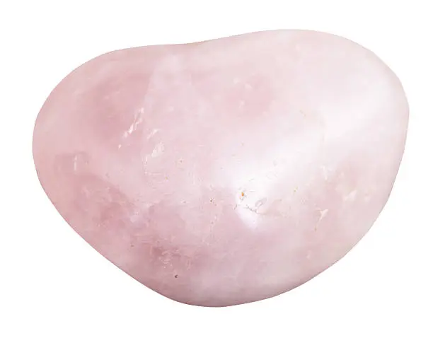 macro shooting of natural gemstone - pebble of rose quartz mineral gem stone isolated on white background
