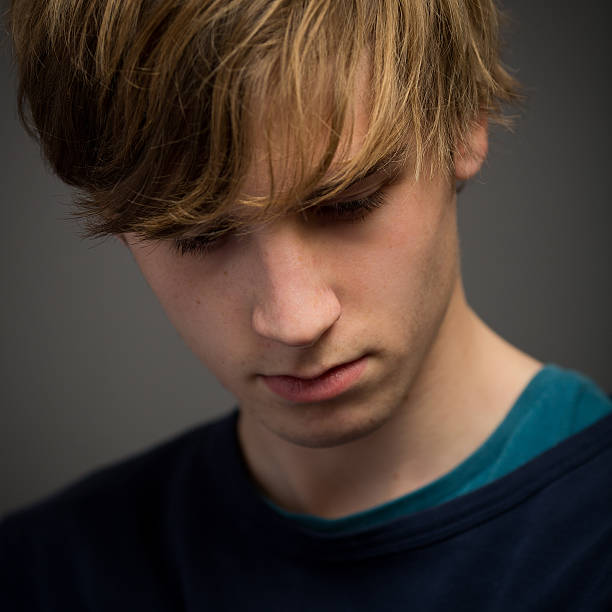 istock Confident Teenage Blond Young Man In The Studio 516494926