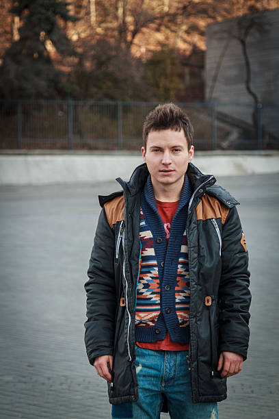 istock young handsome guy on the street in a black jacket 516495310