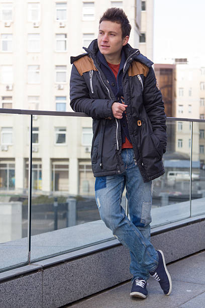 istock young handsome guy on the street in a black jacket 516495582