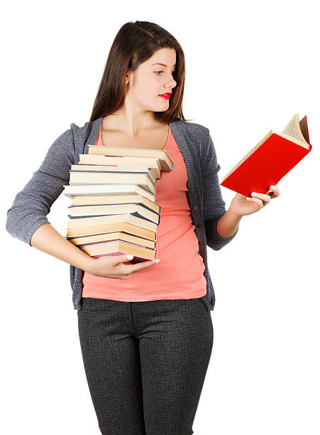 istock Girl with books isolated on white background. 516495712
