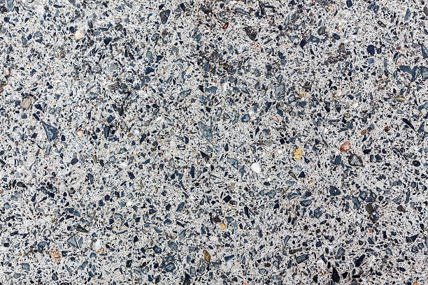 Stone slab with small inclusions. Grey texture. stock photo