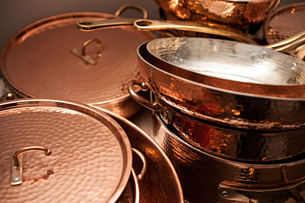 Close up view of copper cooking pots
