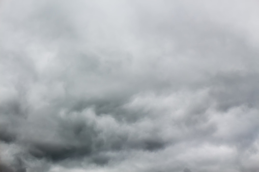 Overcast sky with dark stormy rain clouds. Nature grey background