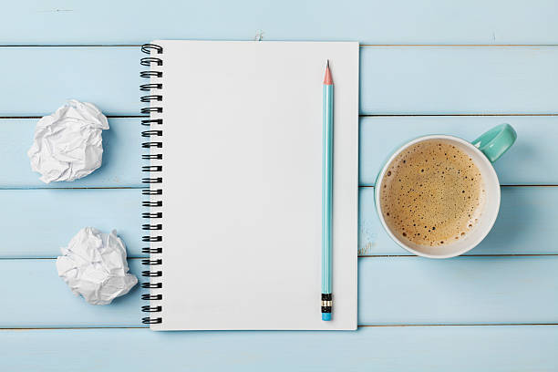 istock Coffee mug, clean notebook, pencil and crumpled paper, creative concept 516502104