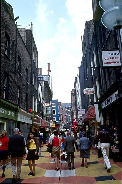 Carnaby Street, London London, England, United Kingdom, May 20, 1971. The Carnaby Street on a busy day. One of the first pedestrian zones in London and a famous fashion shopping mile in the time of Swinging London. london girl stock pictures, royalty-free photos & images