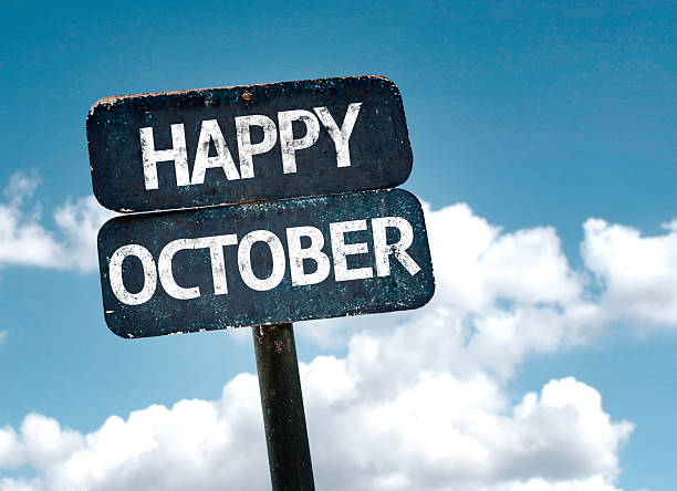 istock Happy October sign with clouds and sky background 516505371