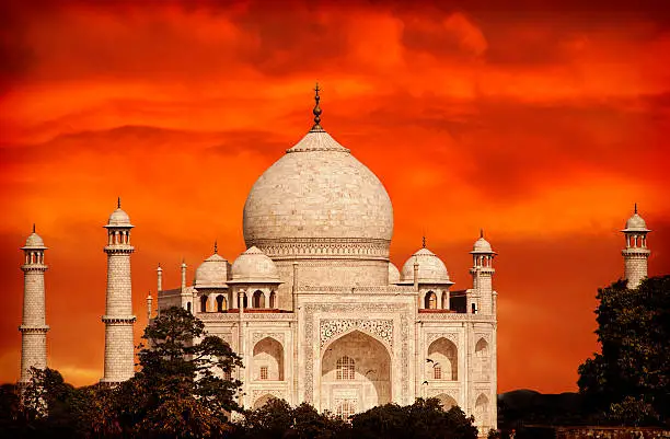 Photo of Retro filtered sunset over Taj Mahal, India.