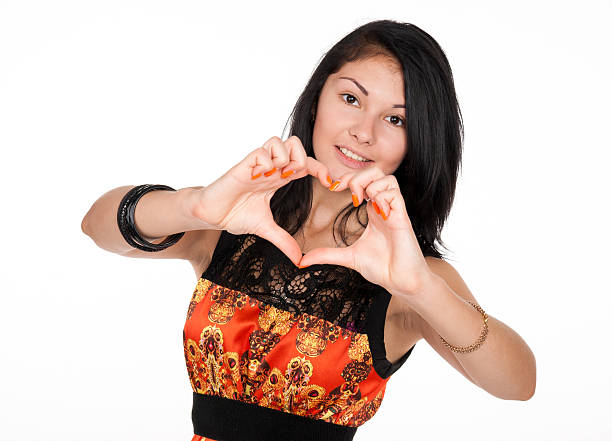 istock attractive brunette shows a heart symbol 516505641