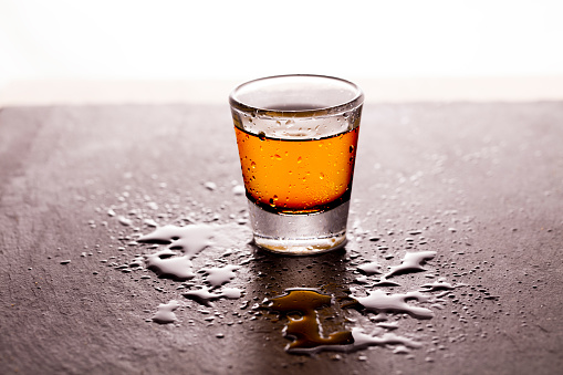 Whisky shot on a slate table