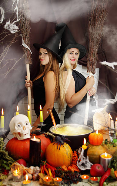 istock Two witches with a broom, tinted 516505955