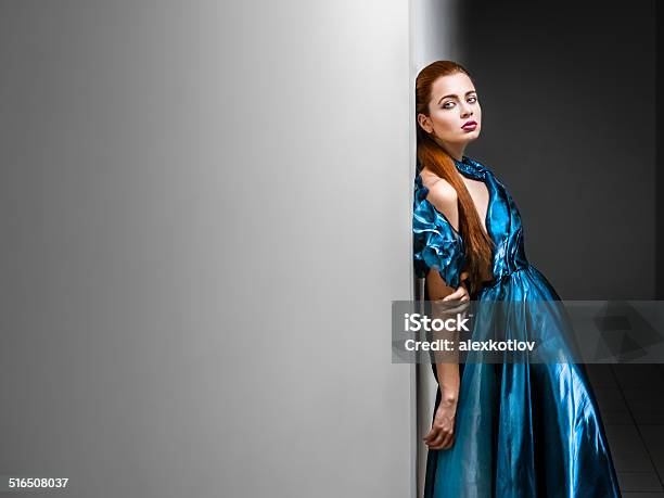 Portrait Of Young Woman In Blue Dress Stock Photo - Download Image Now - Adult, Adults Only, Arts Culture and Entertainment