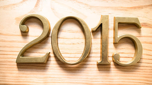 istock 2015 gold numbers text on plank wood 516508867