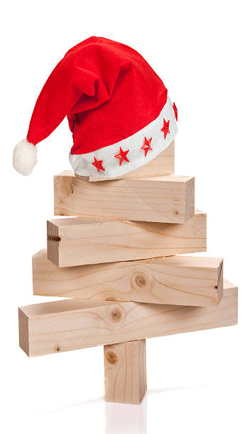 istock Santa Hat on stacked lumbers in the shape 516509005