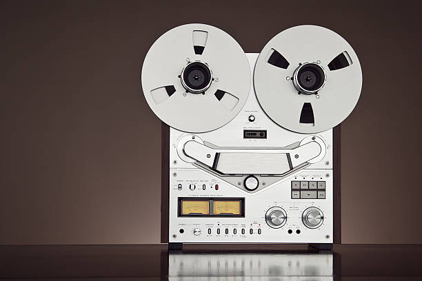 istock Analog Stereo Open Reel Tape Deck Recorder Vintage Closeup 516509061