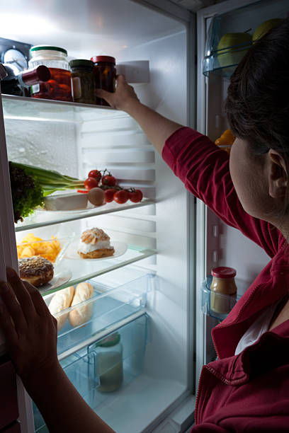 istock Hungry woman choosing food 516509185