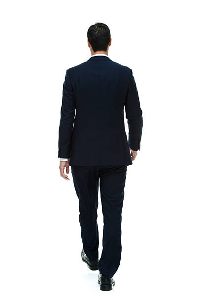 istock Rear view of businessman walking 516511053