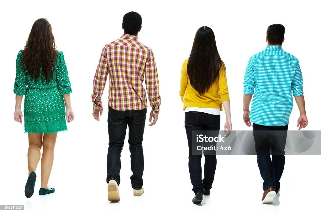 Rear view of four people walking together Rear view of four people walking togetherhttp://www.twodozendesign.info/i/1.png People Stock Photo