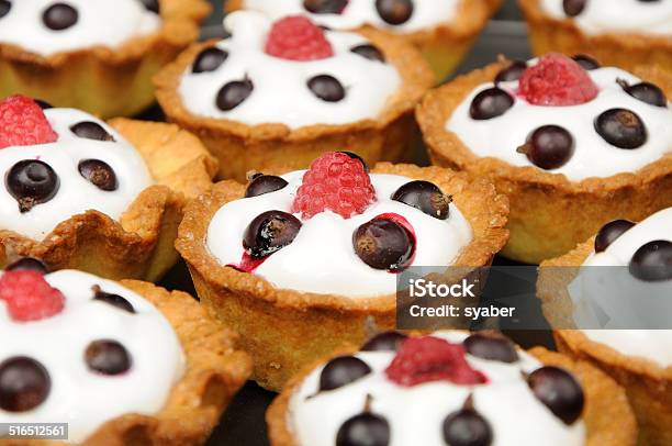 Baked Baskets With Cream Black Currant Ant Raspberry Stock Photo - Download Image Now