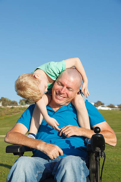 istock Dad play with son outdoor at park 516526643