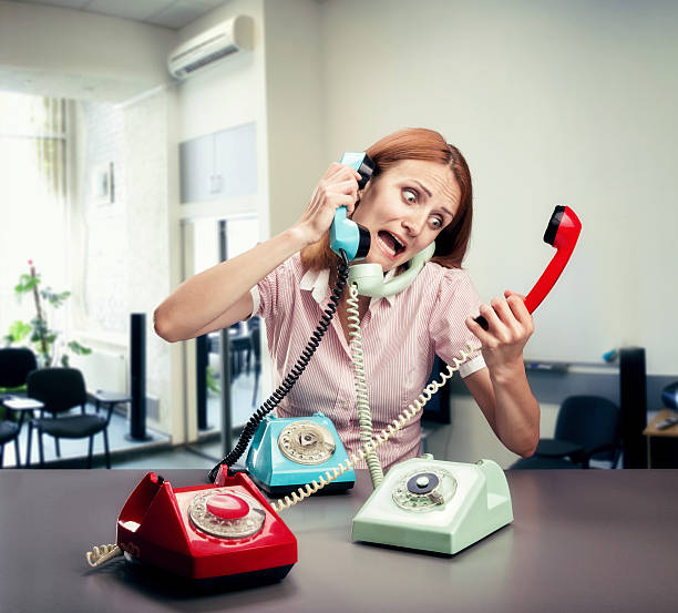 istock Stressed woman with three phones 516526827