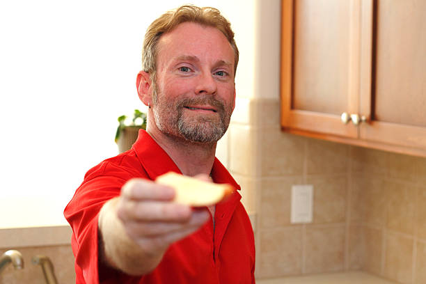 Man Giving Apple Slice to Viewer