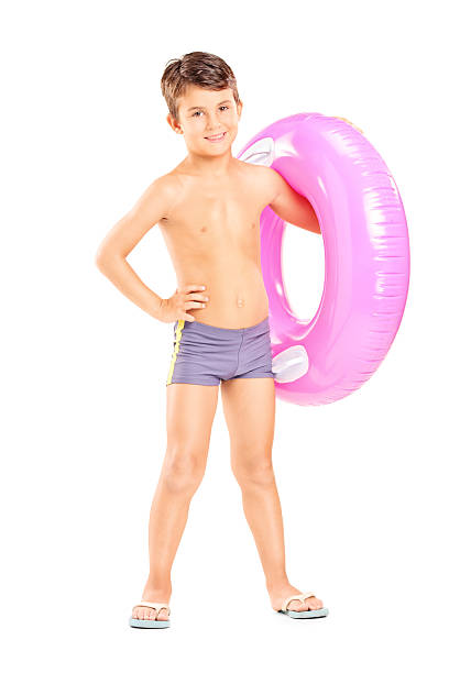 istock Cute little boy holding a swim ring 516529401