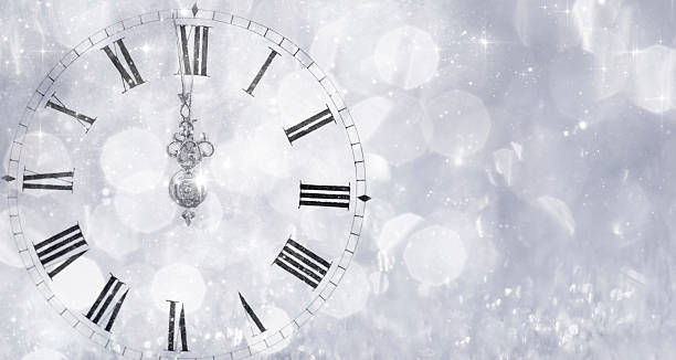 istock New Year's at midnight - Old clock and holiday lights 516530901