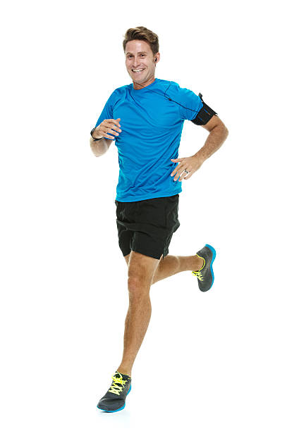 веселый мужской бегун, бег - male sportsman front view vertical стоковые фото и изображения