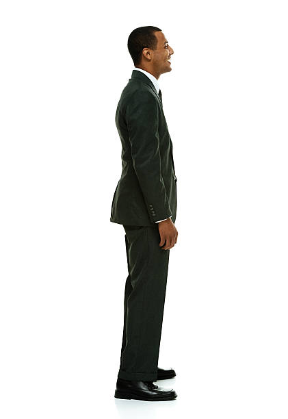 istock Cheerful businessman standing & looking away 516531847