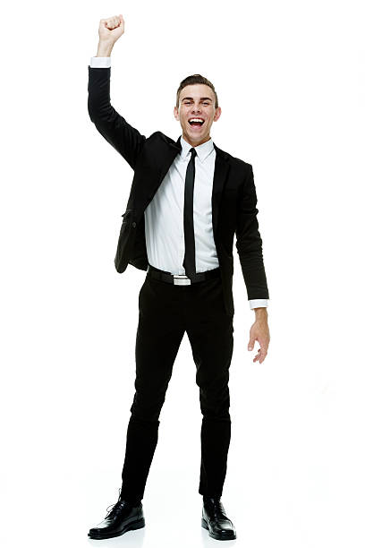 istock Cheerful businessman cheering with hand raised 516533479