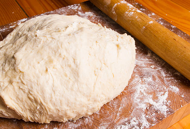 istock dough on a wooden Board 516541694