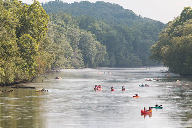Atlanta, GA, USA - July 25, 2015:  People raft, kayak and canoe down the  Chattahoochee River on a hot summer day on July 25, 2015 in Atlanta, GA.