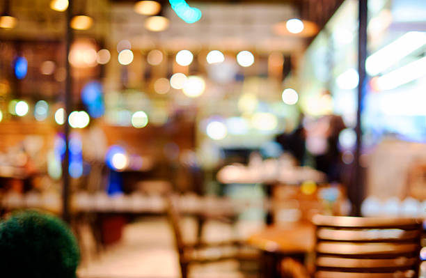 istock image of blur restaurant in night time for background 516542720