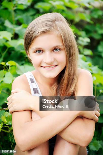 Summer Spring Preadolescent Girl Blonde Hair Smiling Having Fun Sitting Stock Photo - Download Image Now