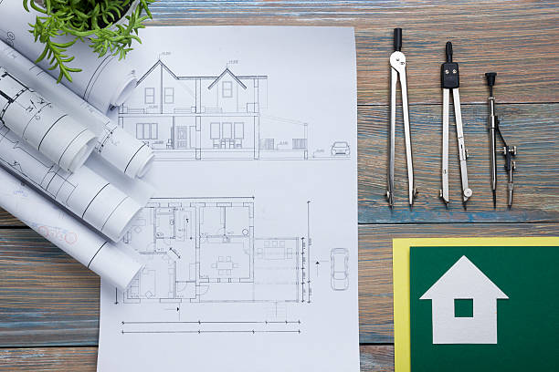 istock Real Estate concept. Architectural project, blueprints, blueprint rolls and  divider 516543504