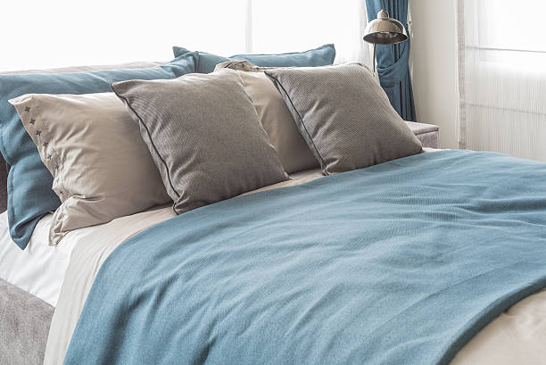 istock modern bedroom with blue color theme 516543522
