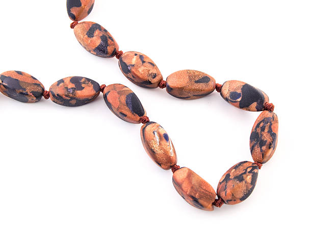 istock mineral gem stone brown orange gold Aventurine gemstone on white 516543632
