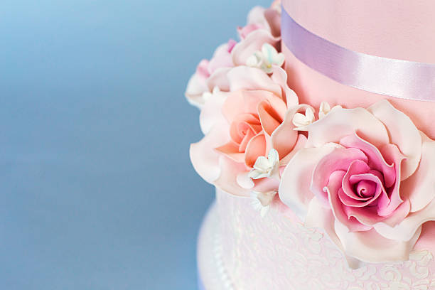 istock Cake decorated with flowers on a blue background 516543724