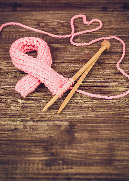 istock Knit to help find a cure. Breast Cancer Awareness Symbol 516544174