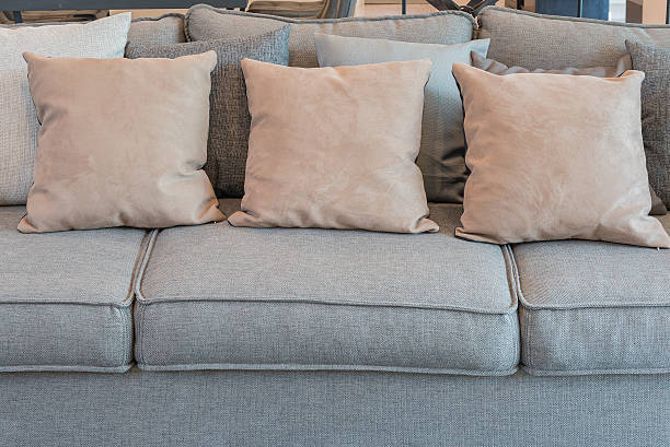 istock pillows on grey sofa in modern living room 516545402
