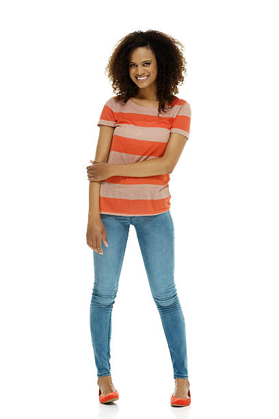 istock Cheerful woman standing & looking at camera 516545911